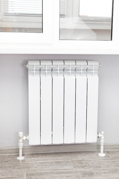 Heating white radiator radiator in living room.