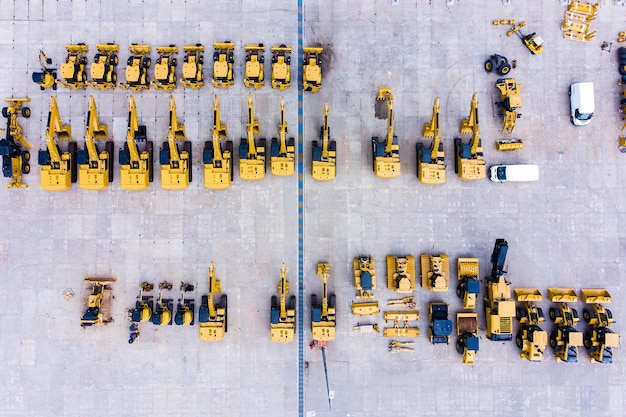 Heavy construction equipment store excavator bulldozer grader front loader aerial view