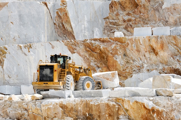 Heavy duty loader moving marble blocks