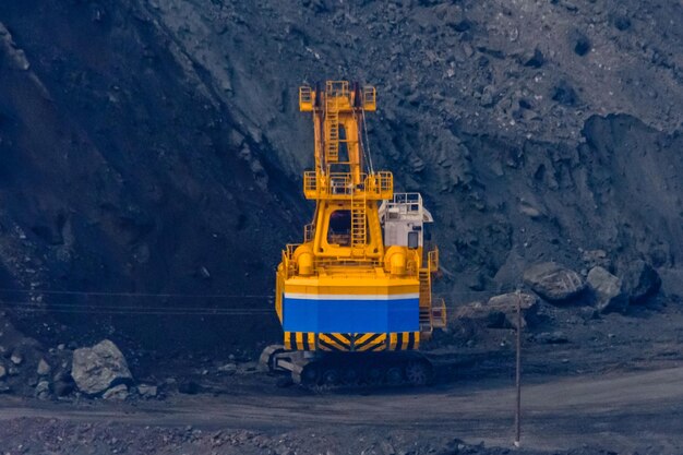 Heavy excavator working in the iron ore quarry