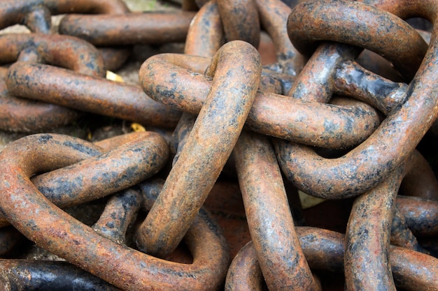 Heavy metallic randomly arranged messy chain with orange rust