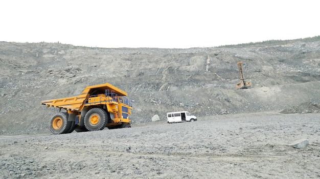 Heavy mining trucks moving on a limestone quarry heavy equipment