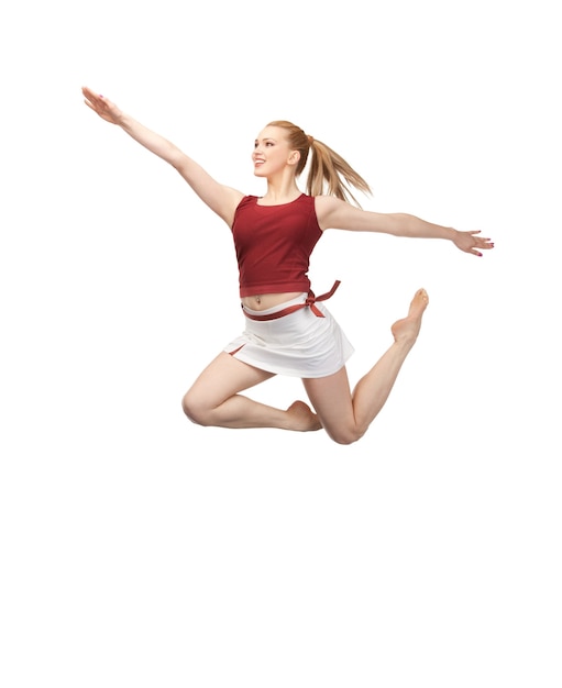 helder beeld van vrolijk springend sportief meisje