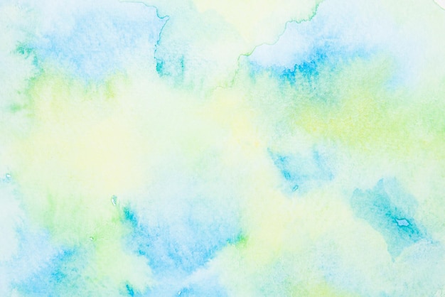 Helder blauw en groen aquarel op papier achtergrond