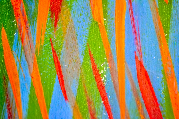 Foto heldere gevarieerde achtergrond van gekleurde lijnen van penseelstreken gemaakt met verf