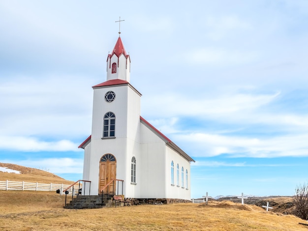 Helgafell church classic architecture building of iceland church on hill under cloudy blue sky