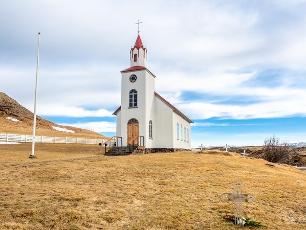 Helgafell church classic architecture building of iceland church on hill in winter season under cloudy blue sky