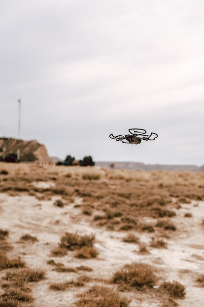 Photo helicopter flying over land