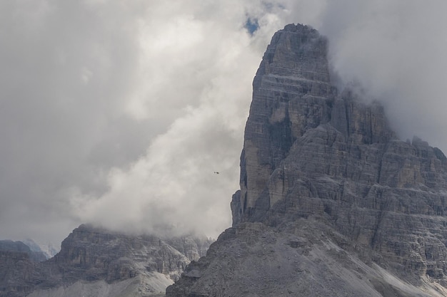 Helicopter used for rescue operations on Tre Cime di Lavaredo in Dolomites, Italy.
