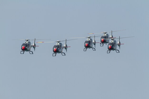 Helicopters of the Patrulla Aspa taking part in an exhibition