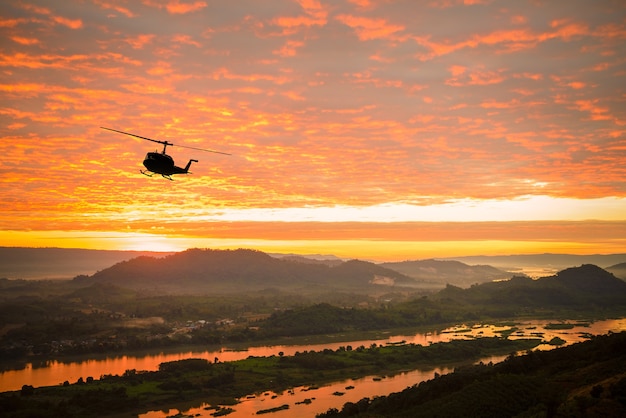 helicoptor on sunset at river