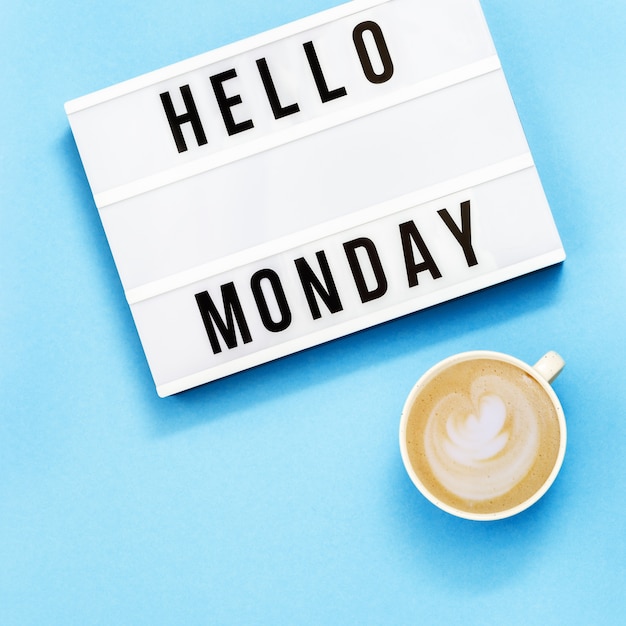 Hello monday sign and a cup of coffee