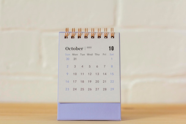 Hello OctoberDesktop calendar for October 2022 on the table