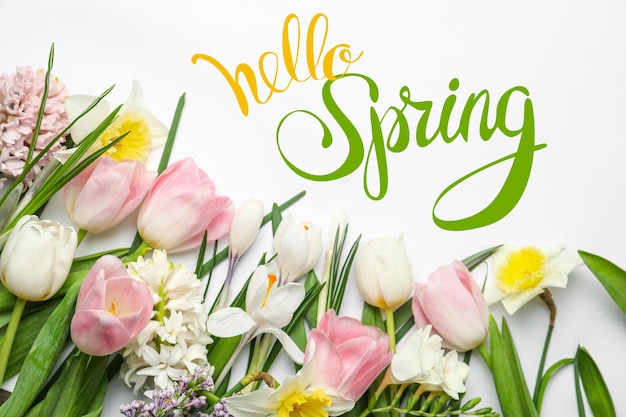 Hello Spring Beautiful flowers on white background flat lay