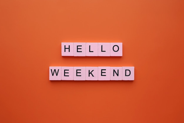 Hello weekend, on an orange background.