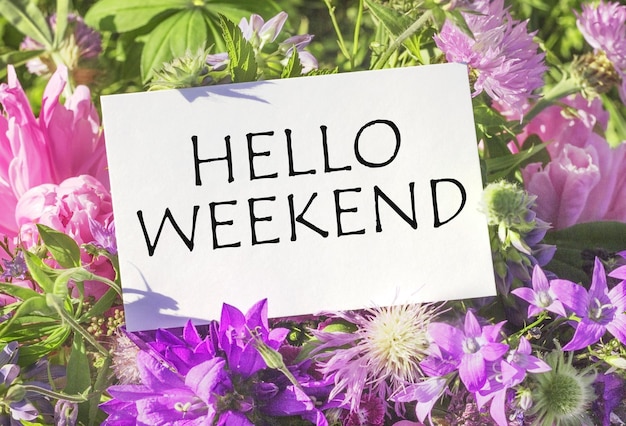 Hello weekend white card for a bouquet with the inscriptionCopy space