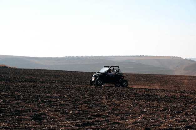 helmet sitting on atv quad bike in mountains