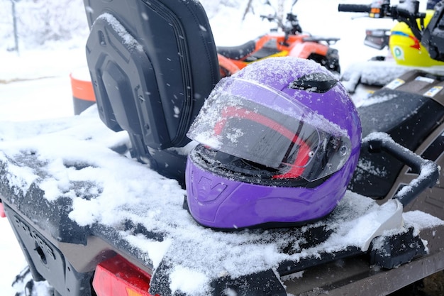 helmet sitting on atv quad bike in mountains