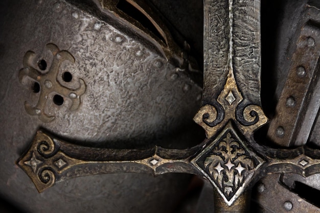 helmet and sword, close up photo, background.