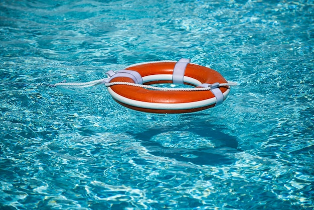 Help and drowning concept life saver ring floating in the water