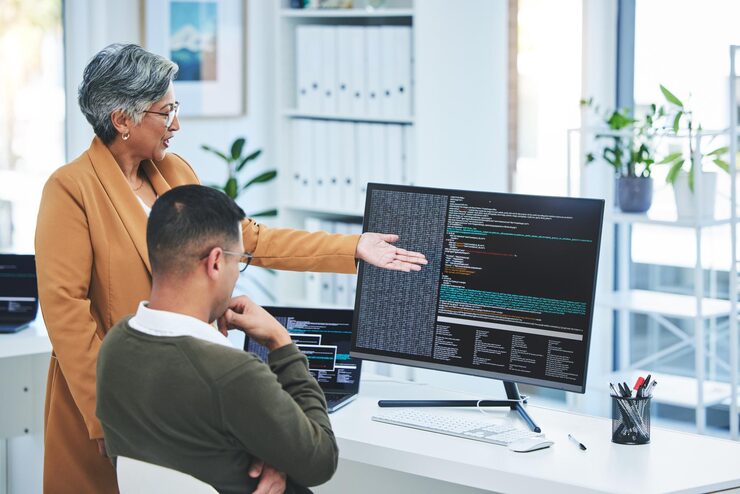 Photo help manager and employee with computer screen programming and code with trading coaching and mentor advice supervisor and worker with pc coding and cyber security with programmer and training