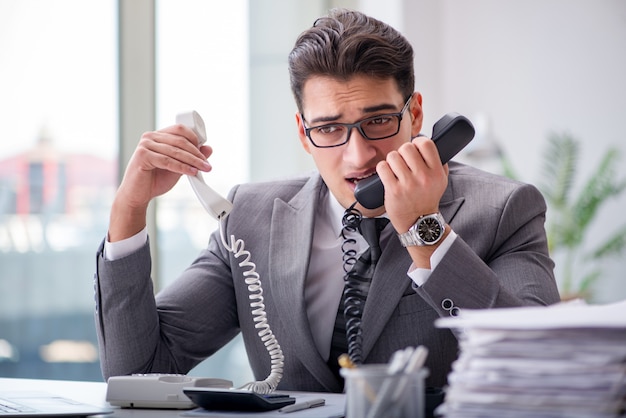 Helpdesk operator talking on phone in office