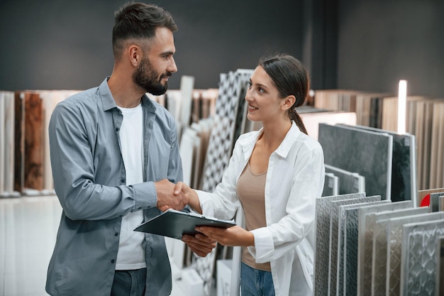 Helping the customer Woman and man is in the store of goods for the home