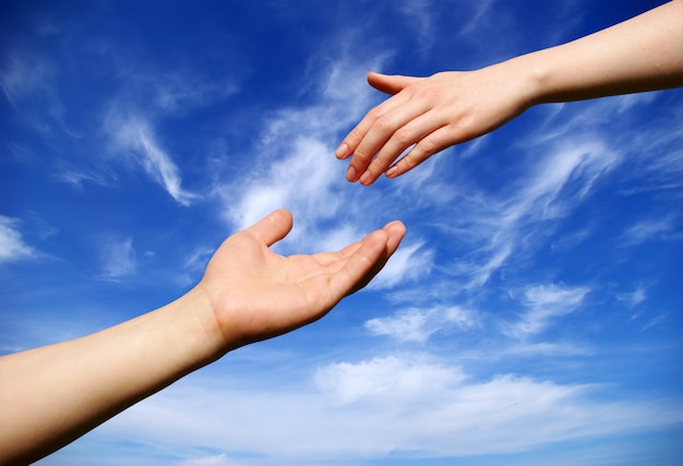 Helping hand on sky