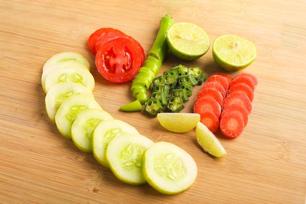 Helthy food concept  Raw vegetable slices on wooden board