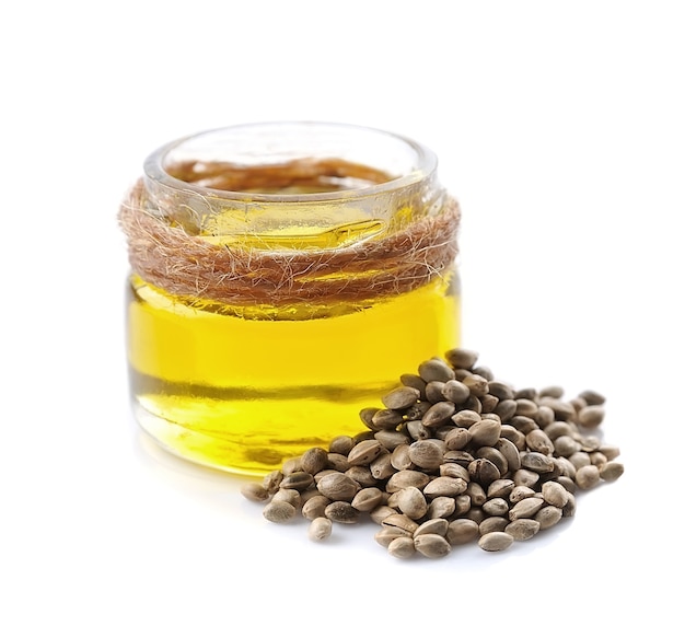 Hemp oil and hemp seeds isolated on white