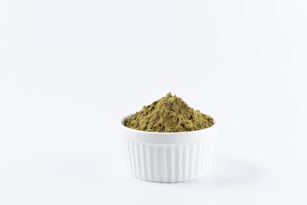 Hemp protein in a bowl on a white background