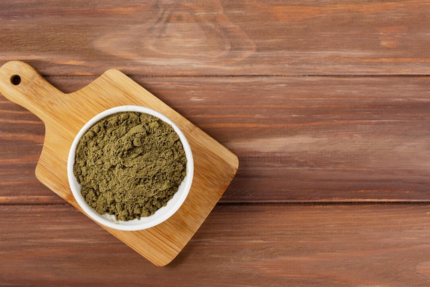 Hemp protein in a bowl on a wooden table Horizontal orientation top view copy space