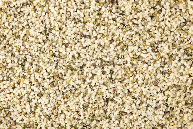 Hemp seeds background, top view