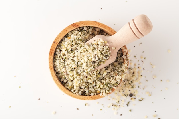 Hemp seeds in wooden bowl, top view