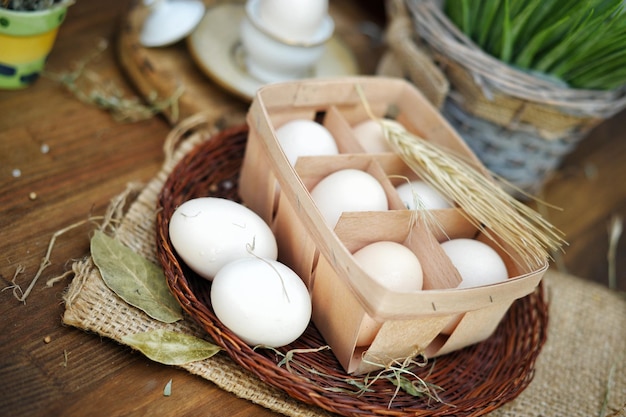 Hen eggs in basket