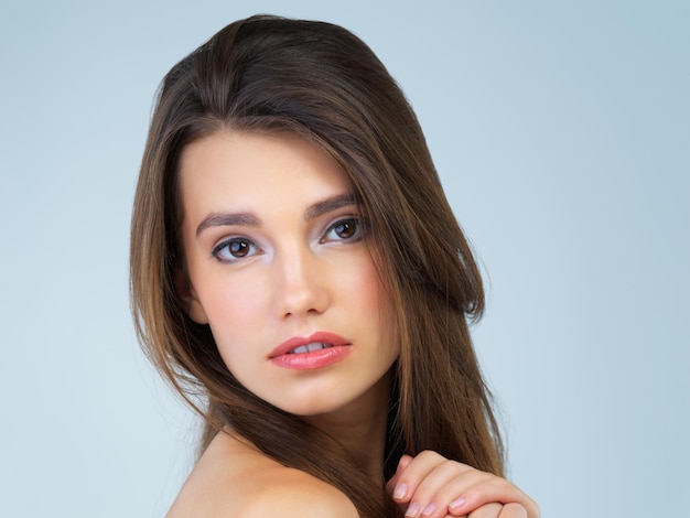 Her beauty is immeasurable Studio portrait of a beautiful young woman posing against a blue background