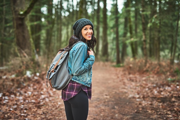 On her journey through the woods she goes Cropped shot of a young woman in the woods