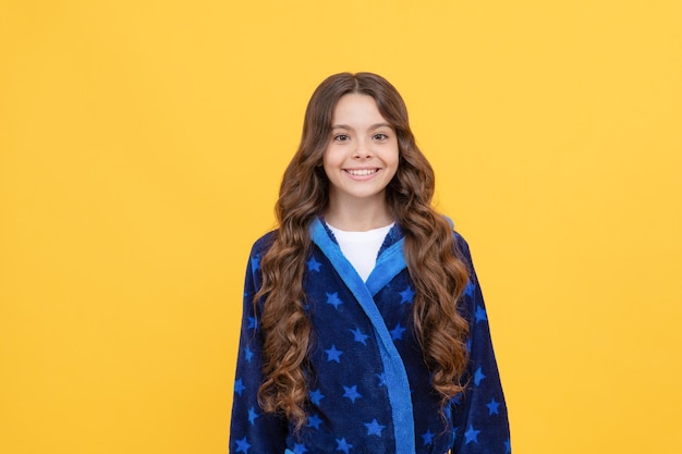 Her perfect look. good morning. sweet dreams. feeling relaxed and happy. childhood happiness. cheerful teenage girl with curly hair. cute child in sleepwear. smiling kid wearing soft night suit.