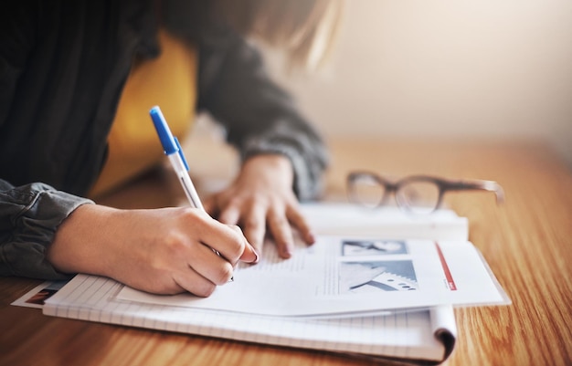 Her study methods are take notes Cropped shot of an unrecognizable female university student in class