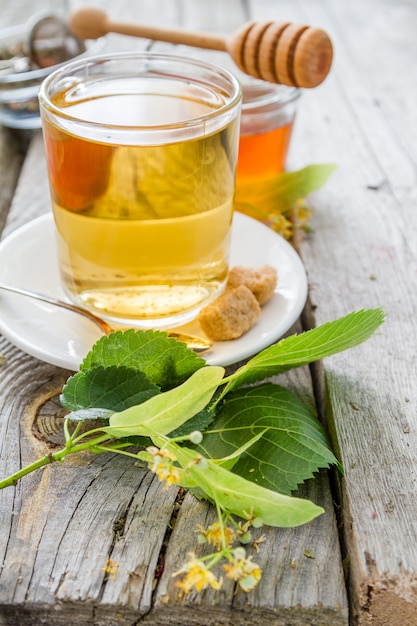 Herb tea in glass cup with honey