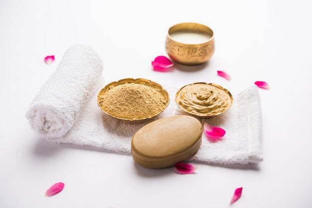 Herbal or Ayurvedic face Pack using Multani mitti, milk etc placed with Soap, towel. Selective focus