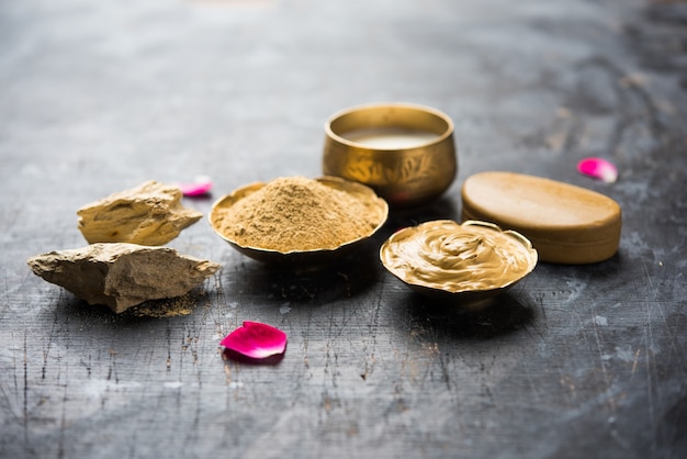 Herbal or Ayurvedic face Pack using Multani mitti, milk etc placed with Soap, towel. Selective focus