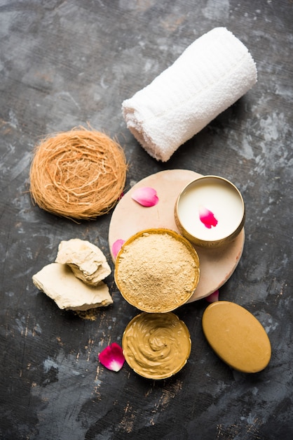 Herbal or Ayurvedic face Pack using Multani mitti, milk etc placed with Soap, towel. Selective focus