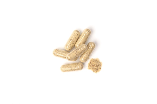 Herbal capsules isolated on white 