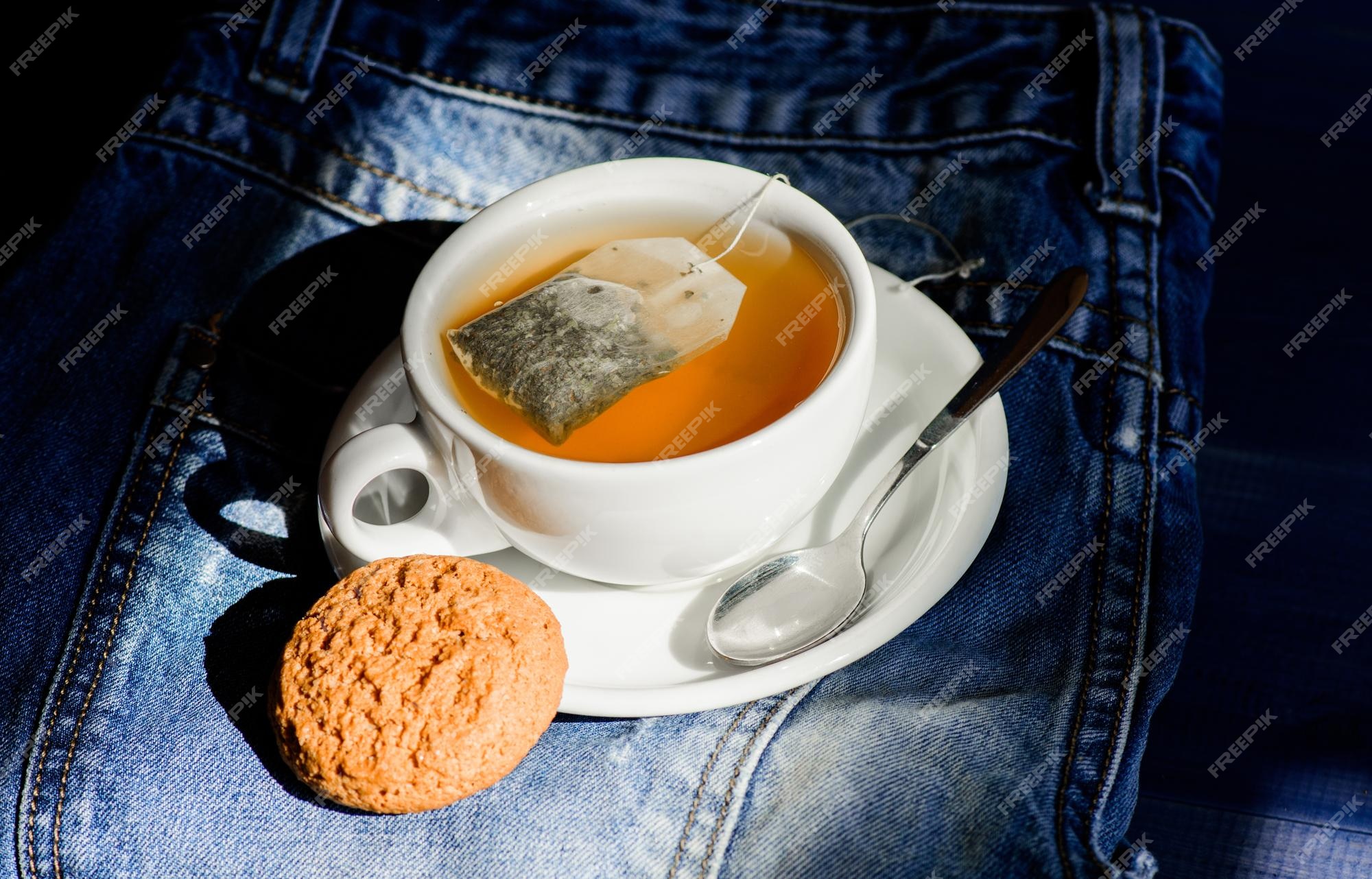 Process tea brewing ceramic mug. Inspiration and peaceful mood. Relaxing  chamomile tea. Cup mug hot tea