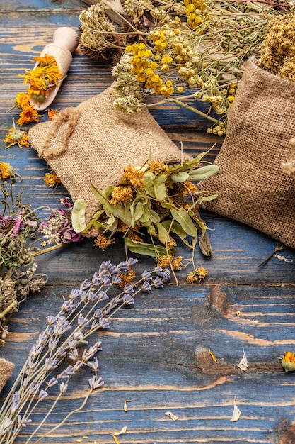 Photo herbal harvest collection and bouquets of wild herbs. alternative medicine. natural pharmacy, self-care concept