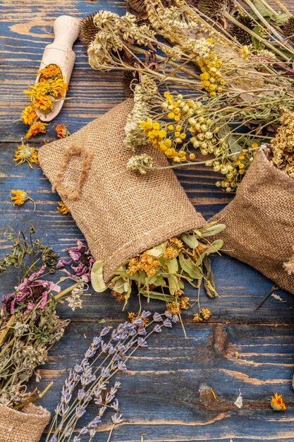 Photo herbal harvest collection and bouquets of wild herbs. alternative medicine. natural pharmacy, self-care concept