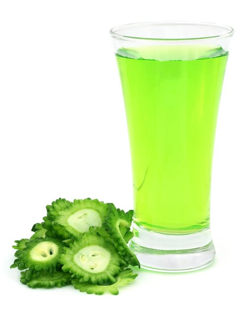 Herbal juice of green momodica over white background