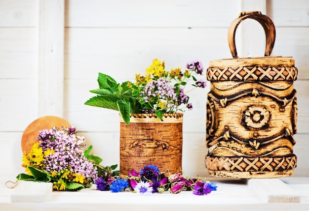 Herbal medicine Healing herbs and flowers in birch bark boxes