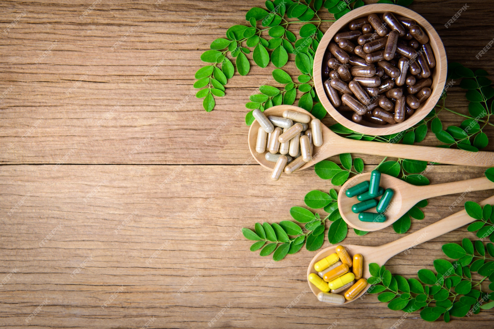 Premium Photo | Herbal medicine supplement from natural on wooden table  background and copy space